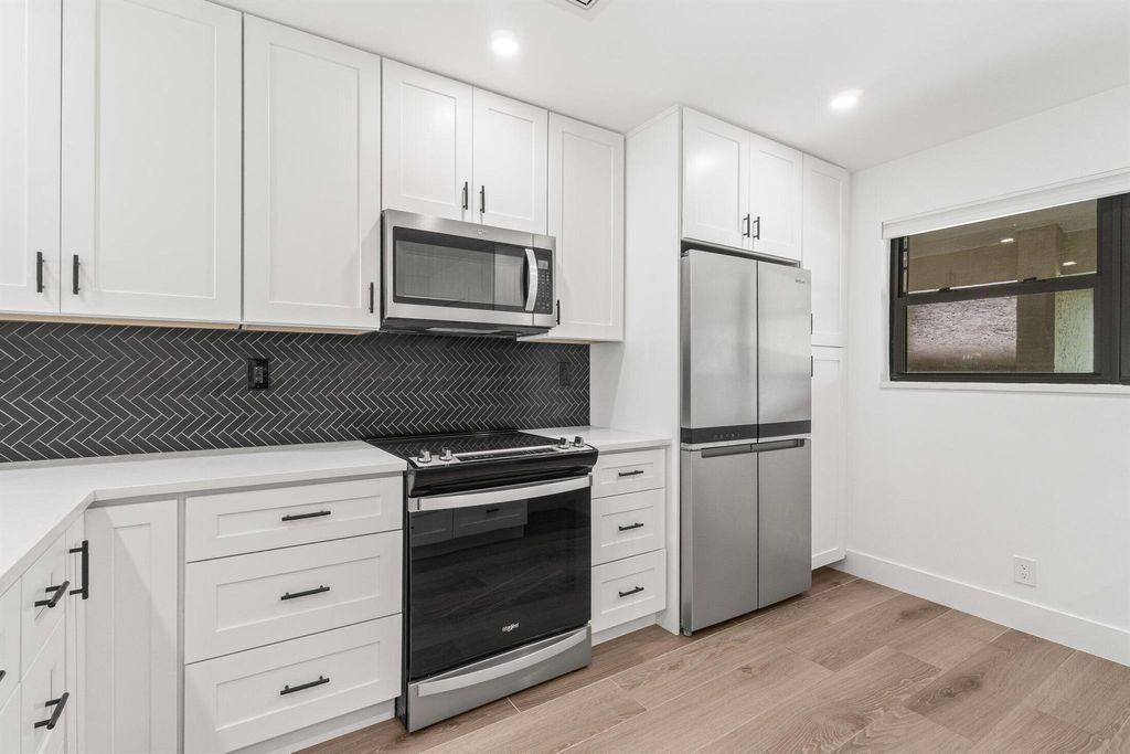 Photo of 12910 Briarlake Drive #201, Palm Beach Gardens, FL 33418 (MLS # R11106017)