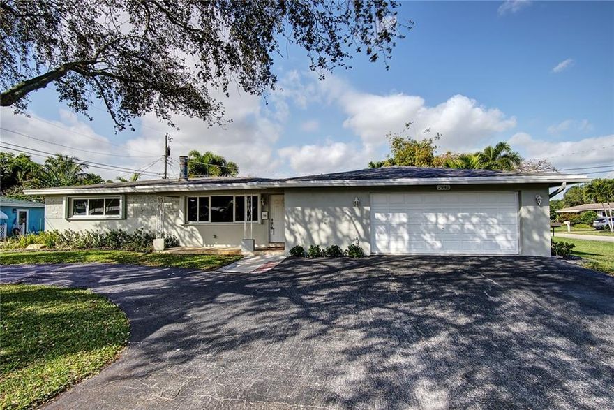 OVER 2084 TOTAL SQ/FT. COMPLETELY REMODELED HOME IN ONE OF THE MOST DESIRABLE NEIGHBORHOODS IN WILTON MANORS! SITUATED ON A BEAUTIFUL CORNER LOT, YOU WILL LOVE THE OPEN FLOOR PLAN & BRAND NEW KITCHEN WITH FRIGIDAIRE APPLIANCES & QUARTZ COUNTERTOPS. FROM THE MOMENT YOU WALK IN YOU WILL NOTICE ALL THE HIGH-END FINISHES FROM THE WOOD BURNING FIREPLACE TO THE IMPACT WINDOWS THAT SURROUND YOU WITH NATURAL LIGHT. THE OVERSIZED 2.5 CAR GARAGE HAS PLENTY OF ROOM FOR STORAGE & A HANDYMAN'S WORKSHOP. IT DOESN'T STOP THERE, THE PRIMARY SUITE FEATURES A LARGE ENSUITE BATH WITH DUAL SINKS & TILED WALK-IN SHOWER. THE HOME HAS BEEN WIRED WITH CAT.5 & COAX CABLE THROUGHOUT, MAKING IT READY FOR ALL YOUR SMART HOME EQUIPMENT.THIS FABULOUS HOME IS ON A QUIET CUL-DE-SAC ST. AND AWAITS ITS NEW OWNERS.