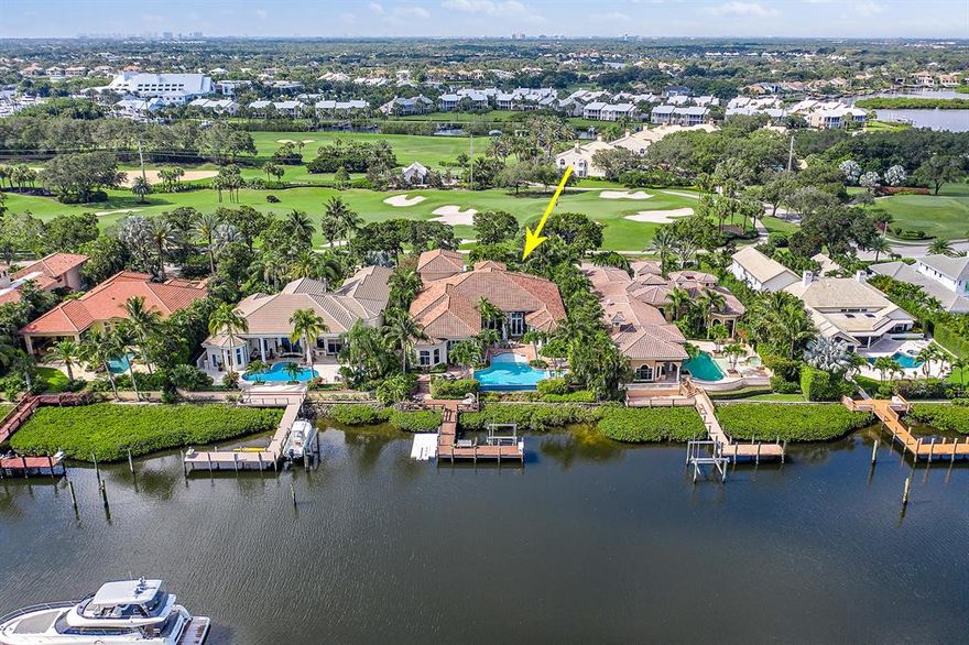 This special home is located on the sought after street of Spyglass Lane in the prestigious  Admirals Cove. where you have golf in the front of your home and waterways leading out the Intracoastal in the back.   Custom built by Mustapick Builders, the home features a large master suite with a sitting area, breakfast bar, his and her closets and baths, a custom gourmet kitchen open to the family room, formal dining room, media room, 3 guest bedrooms and so much more!