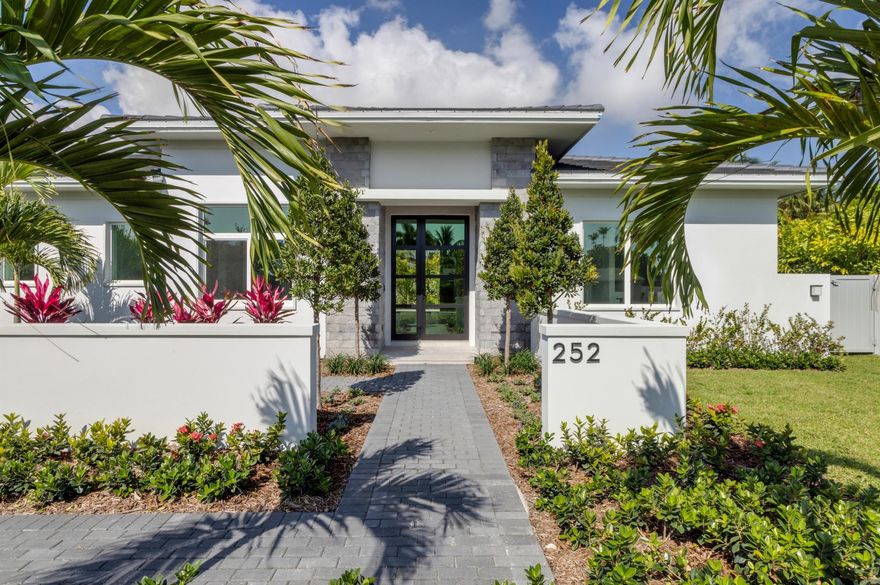 New-construction Coastal-Contemporary masterpiece designed by  Gary Eliopoulos and built by Seaside Builders, features open floorplan, split-layout, with banks of sliding doors in all major rooms opening to the  pool patio in the hedged back yard. In the desirable Lake Eden neighborhood, this residence is minutes from the ocean, downtown Delray Beach and the Delray Beach Playhouse.