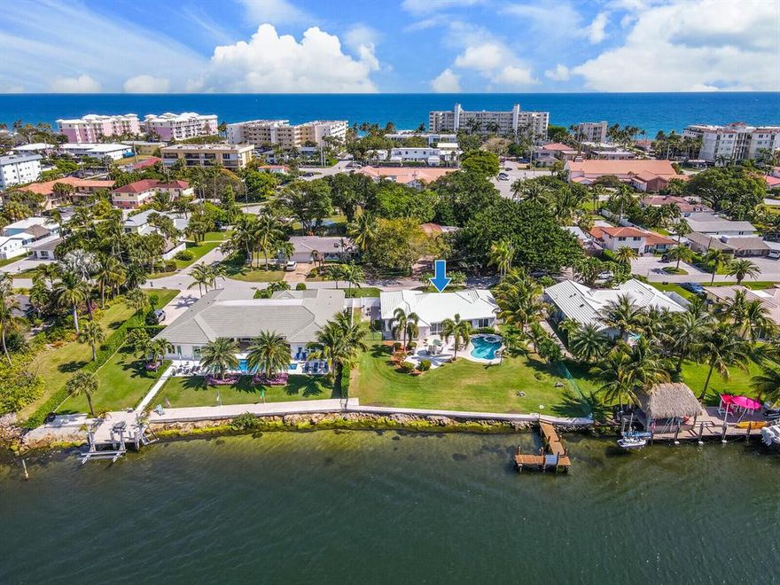 Unique, desirable, and highly coveted, this Intracoastal Front Estate is ready for its new, proud owner. Boasting 100 feet of water frontage with unobstructed glimmering views and fresh ocean breezes, the possibilities for this RARE slice of paradise are endless. One of (if not) the BEST LOTS on the Deerfield Beach Barrier Island. Walkable to Deerfield's Award-Winning Blue Wave Beach, pier and dining. Flooded with natural light, the current spacious and open concept layout offers a split bedroom floor plan plus Florida room with wall to wall sliders for panoramic views throughout the home. Enjoy sunsets like no other: the backyard is a true tropical oasis with its freeform pool and spa, large patio. Seawall & dock are boat-lift ready. A MUST SEE! Live in as- is, renovate, or build new