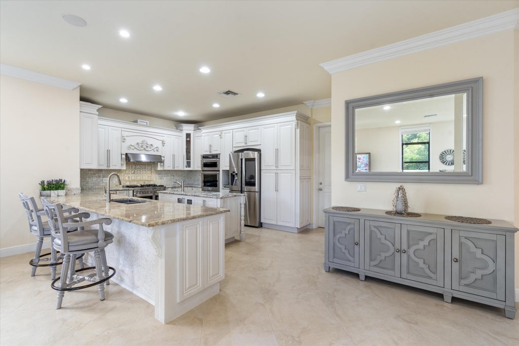 Photo of 301 SANDALWOOD Lane, Boca Raton, FL 33487 (MLS # B26073190)