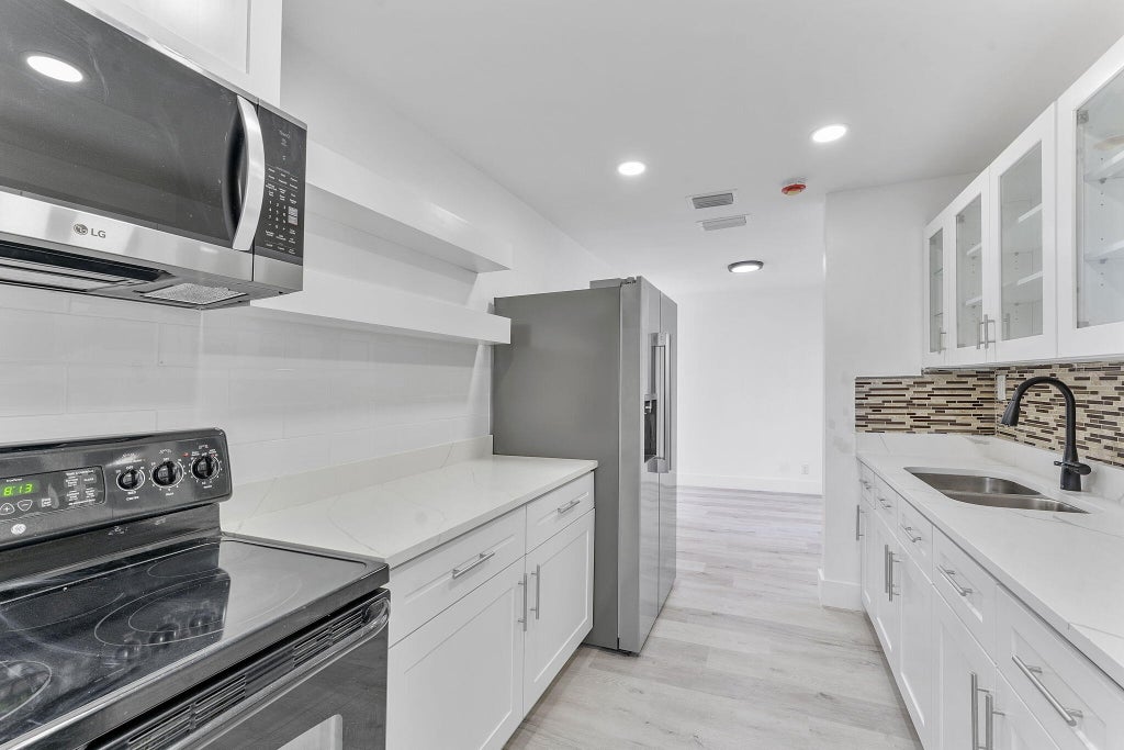 Photo of 120 NE 5th Street, Deerfield Beach, FL 33441 (MLS # R11105632)