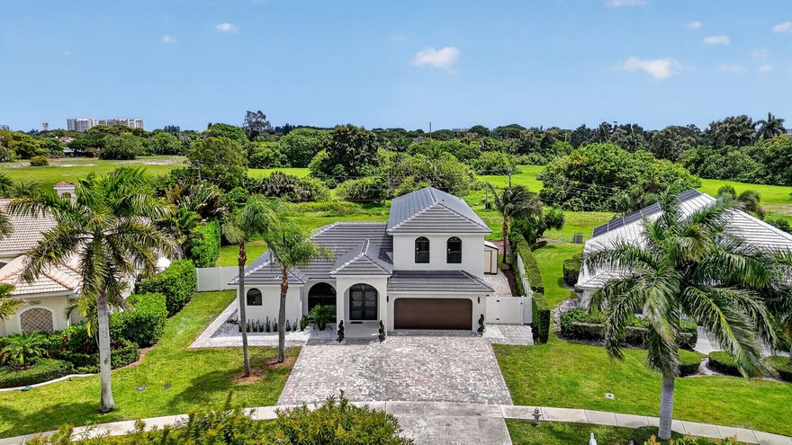 Modern luxury in a highly coveted East Boca location with easy access to I95, top dining, shopping, and A-rated schools. Fully renovated, this stunning 4-Bedroom, plus Den, 3.5 Bathroom Pool home showcases top of the line appliances and finishes. 10 ft ceilings throughout enhance the sense of space and elegance, complemented by beautiful flooring throughout the home. The main level offers a spacious living room with great natural lighting, dining room, and family room, all ideal for everyday living and entertaining. The gourmet kitchen is a chef's delight, featuring stainless steel KitchenAid appliances, 10 ft waterfall island, and bar with built in Bosch coffee machine. The primary suite is located on the main floor with a spa like bathroom and a custom built-in closets. Upstairs you will find 3 bedrooms plus very spacious den, along with 2 bathrooms, offering privacy and separation from the primary suite. The spacious 2-story layout includes all impact windows and doors for energy efficiency, brand new roof, new AC and water heater. Enjoy a covered patio ideal for outdoor sitting year round and a beautifully landscaped exterior designed for easy maintenance and relaxed Florida living.