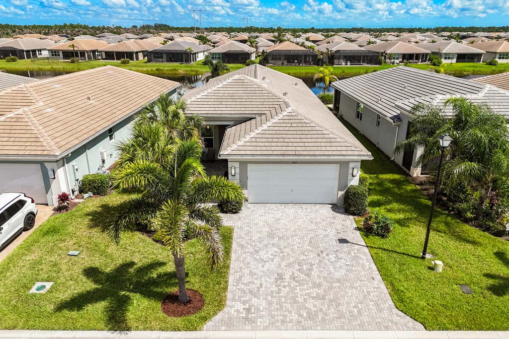 Photo of 13407 SW River Rock Road, Port Saint Lucie, FL 34987 (MLS # B26063615)