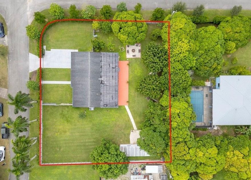 Modern farmhouse-style home in the desirable Redland area situated on a corner 1/2-acre lot surrounded by mature tropical fruit trees including mango, avocado, lychee, and longan. This 4-bedroom, 2-bath single-family home features impact windows and doors throughout, stainless steel appliances, and a water softener system.. Experience peaceful country-style living while still close to shopping, dining, and major highways. No HOA and no CDD