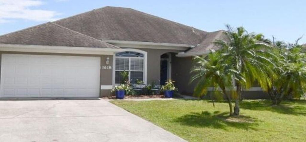 Photo of 1618 SW Nervia Avenue, Port Saint Lucie, FL 34953 (MLS # B26018101)