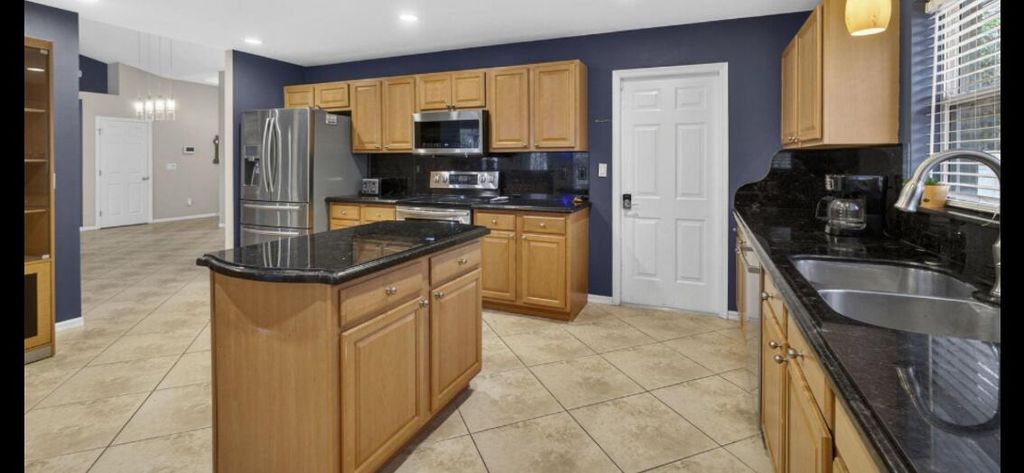 Photo of 1618 SW Nervia Avenue, Port Saint Lucie, FL 34953 (MLS # B26018101)