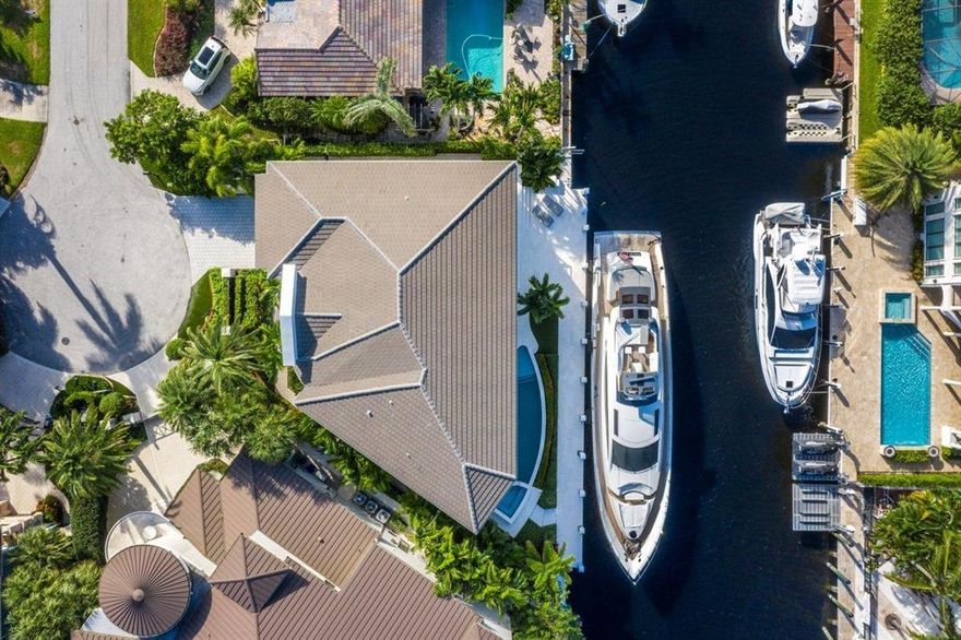 When only the best will do. New construction modern West Indies waterfront estate perfectly encompasses every whim of your imagination. This expertly appointed smart home of your dreams is a jewel of the Mary Widmer Luxury Collection where attention is given to every bit of its design and detail from the platinum 3/4 inch marble and French white oak flooring to the custom metal and glass staircase. Dining is a memorable event in the gourmet appointed kitchen with S.S. Subzero and Thermador appliances. Keep your wine collection pristine in the temperature-controlled wine room and entertain your guests in the clubroom. Fully equipped state-of-the-art smart home technology including Waupaca elevator, Lutron lighting system, Control4 Home Automation, and pre-wired for preferred security system