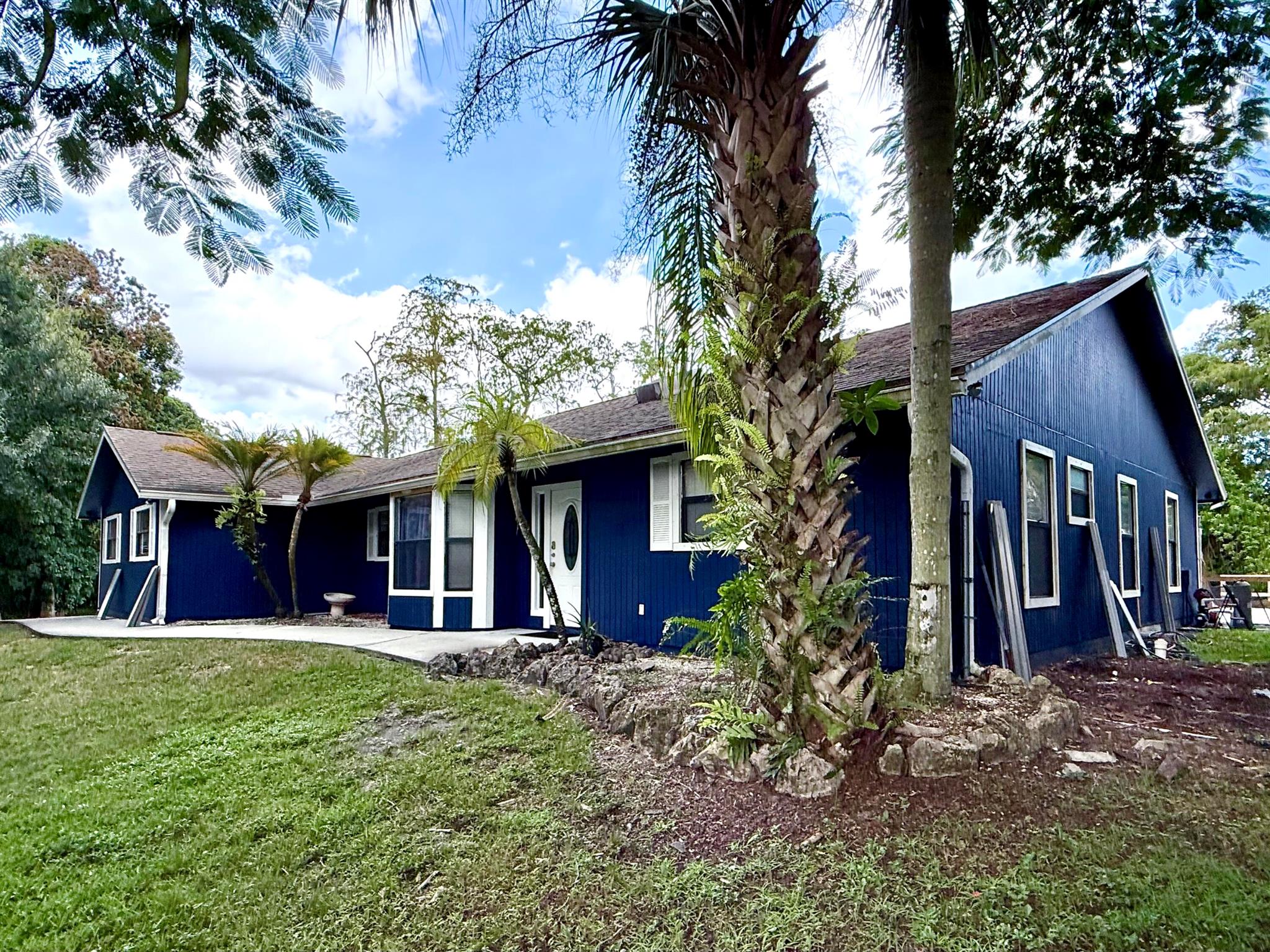 Welcome to your dream retreat in the desirable Palm Beach Country Estates, FL! This spacious 4-bedroom, 2-bathroom, 2-car garage updated home offers 1,711 square feet of comfortable living space, all nestled on an expansive 1.17-acre lot. Perfect for those who love a blend of comfort and nature, this pet-friendly haven comes without the hassle of HOA restrictions.Step inside to discover a welcoming home where relaxation meets functionality. The airy living area invites you to unwind, while the kitchen promises delicious meals with its modern appliances. Outside, the private oasis with the pool offers a refreshing escape on warm days.The location is unbeatable--super close to the freeway for easy commuting, and there are loads of activities nearby for families and kids.