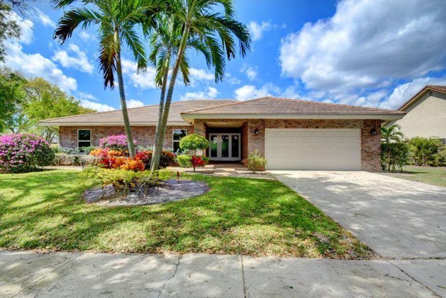 REDUCED FOR QUICK DEAL !!! Excellent central Boca location next to the best schools! Large recently updated 4/2.5 single family pool home on the large corner lot in beautiful Millpond subdivision. All impact doors and windows, coral feature wall with fireplace, oversized and screened in patio and pool area, vaulted ceilings.