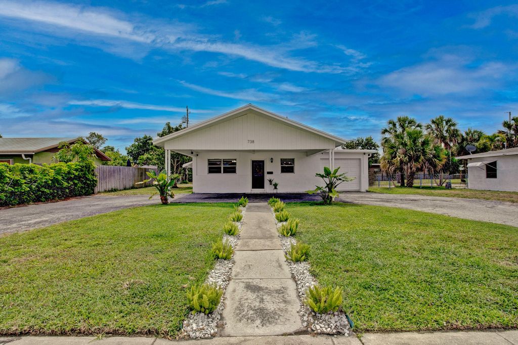 Photo of 738 Foresteria Drive Dr, Lake Park, FL 33403 (MLS # R10788589)