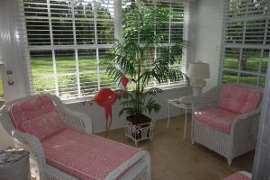 Absolutely adorable! Well maintained and decorated 2 bedroom villa/condo with a Florida room and lovely private view. Nicely tiled throughout. Can be purchased with furnishings, which are just a great fit for this comfortable villa.  This pleasant community has lots of green space, a pool, tennis  and clubhouse.