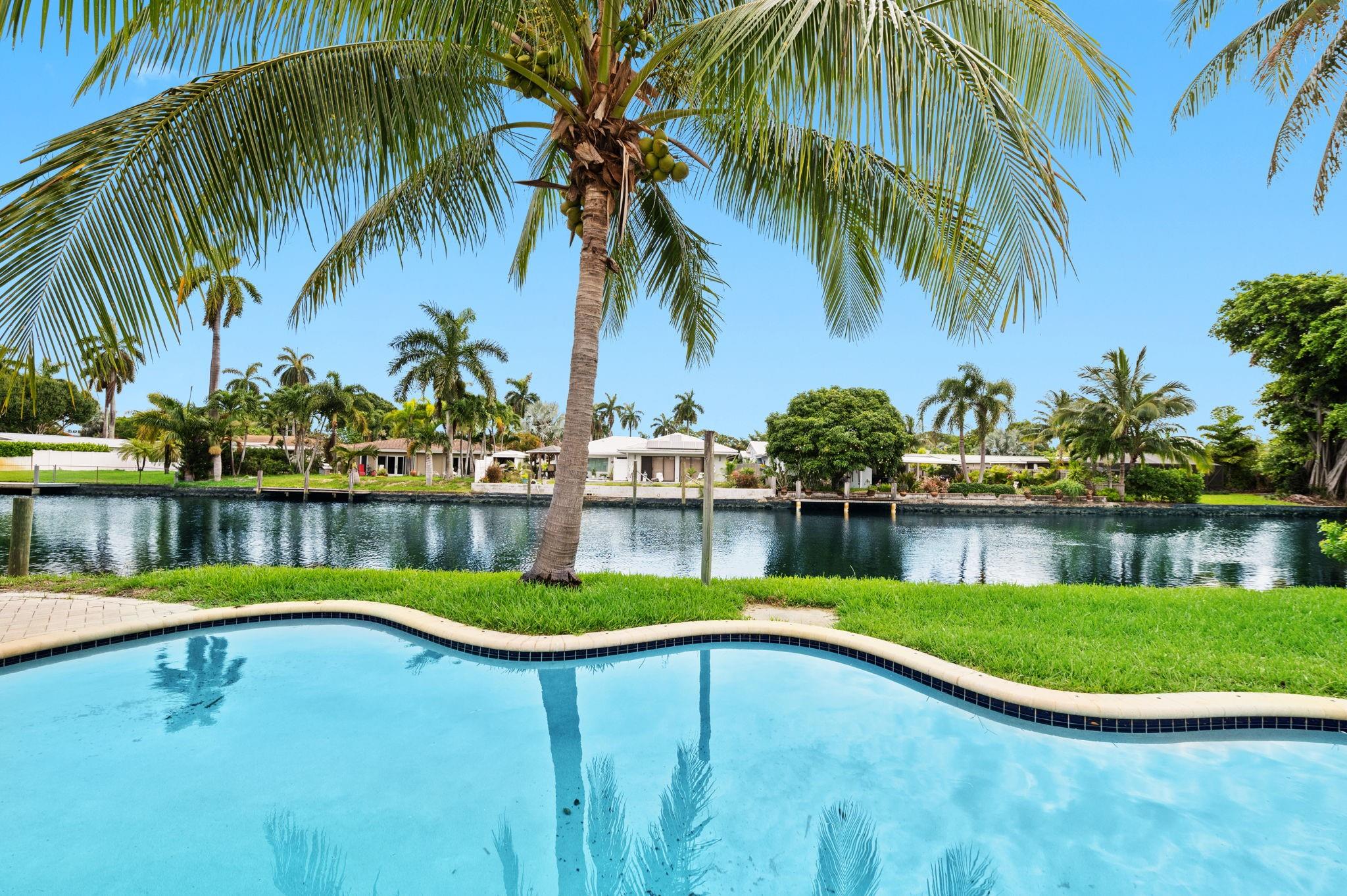 STUNNING WATER, WATER, WATER! This gorgeous home is located in spectacular WILTON MANORS!! Beautiful salt water pool is seen from many vantage points within the home as well as the OCEAN ACCESS waterways to the Atlantic Ocean! Visual tour in supplemental remarks!. Super spacious home with new kitchen and appliances. New porcelain floors. SPOTLESS in ever detail. Semi circle driveway for additional parking. Impact windows. 2/2 with additional den/office/bedroom if wanted. Indoor laundry and utility room. This is truly a stunning home that provide you with constant views of the waterway and pool. Minutes to WILTON MANORS DRIVE by foot, bike or car. Tons of shopping close by. You're going to fall in LOVE with this amazing home. Shown by appt.