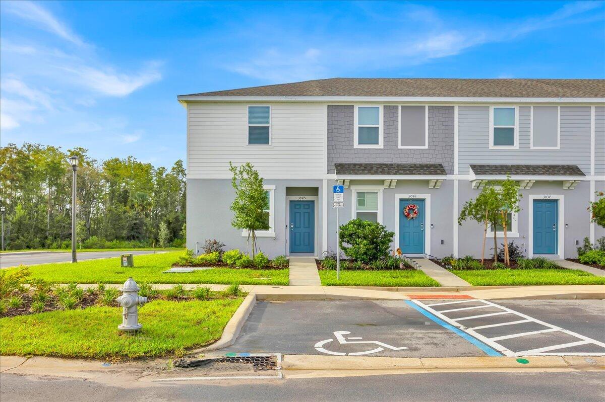 Be the first to live in this bright and stylish corner unit in the Townhomes at Westview! With extra windows, lots of light, and no rear neighbors, this home features a modern kitchen with stainless steel appliances, an open dining and living area, and a private back patio--great for relaxing or entertaining.Upstairs features two bedrooms, both with their own full baths, plus laundry right where you need it. Community perks include a pool, playground, and green spaces.Convenient location close to Disney, Legoland, SeaWorld, shopping, dining, and highways. Available now--schedule your showing today!