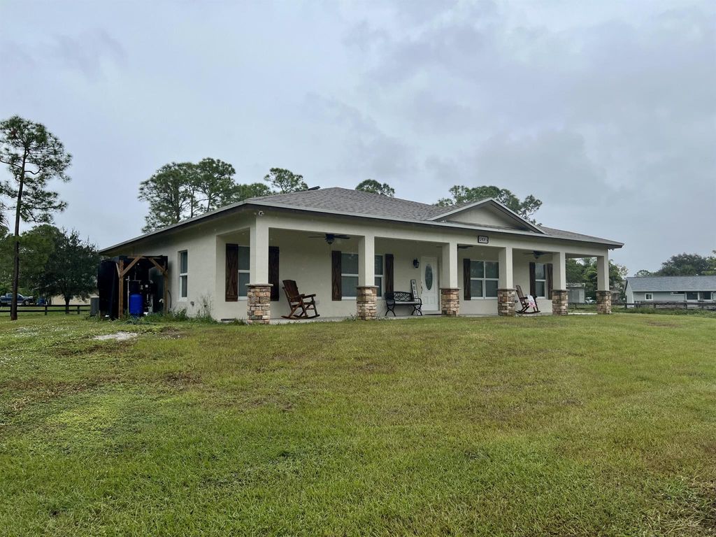Photo of 12065 62nd Lane N, The Acreage, FL 33412 (MLS # R10937513)
