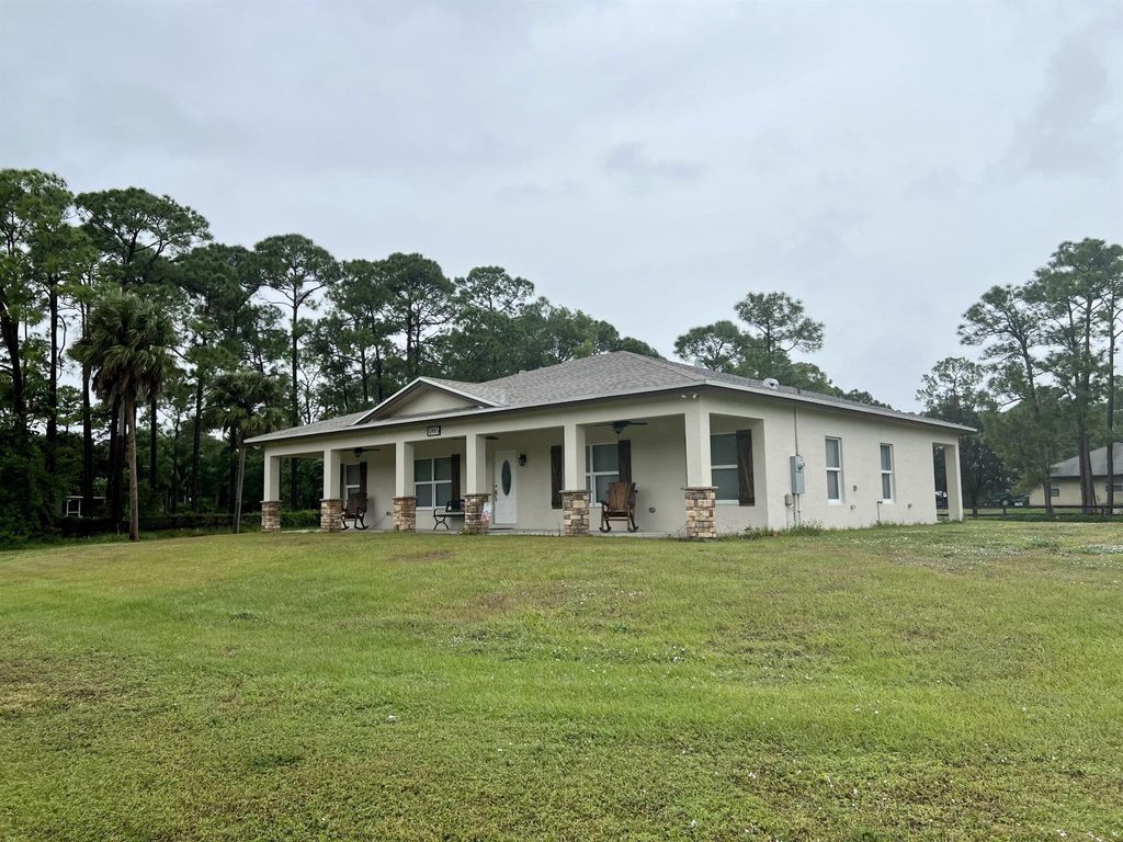 Photo of 12065 62nd Lane N, The Acreage, FL 33412 (MLS # R10937513)