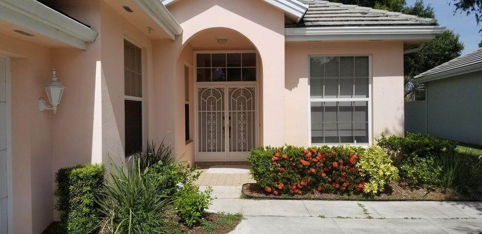 This spacious and spectacular lake view home is located in the Country Club Estates a Gated Community in the heart of Saint Lucie West and boasts an ample living area, kitchen with granite countertops and stainless steel appliances. Tile throughout but bedrooms. beautiful water views all day with all around serenity. Literally within walking distance to shopping, restaurants and other community amenities. Lake fenced but no gates on the sides. HOA approval is mandatory.