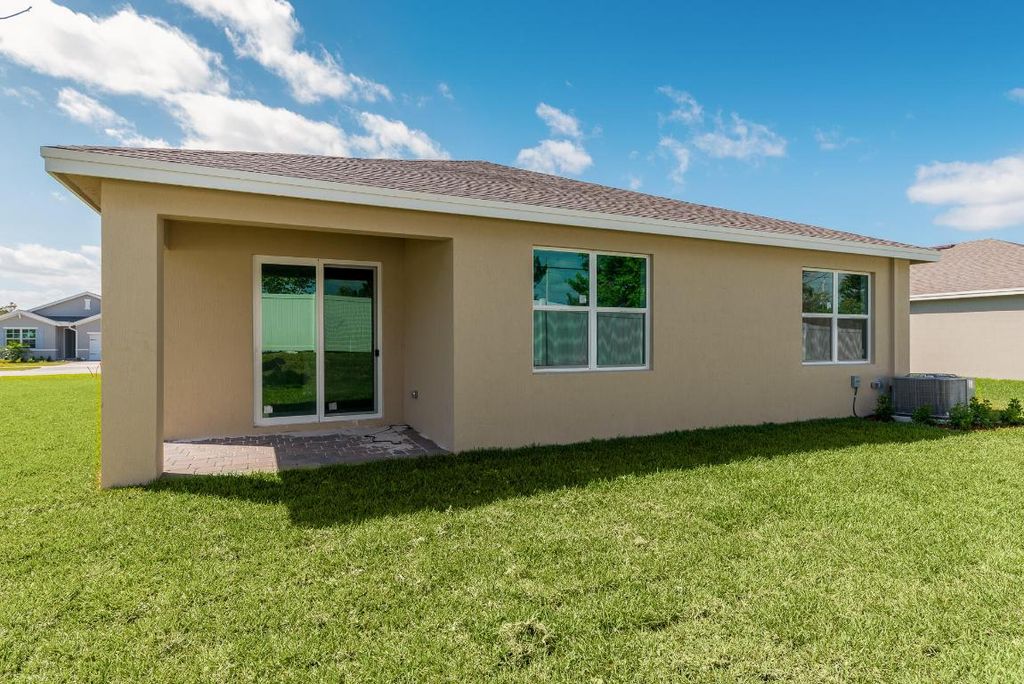 Photo of 1569 NE Skyhigh Terrace, Jensen Beach, FL 34957 (MLS # R10969038)