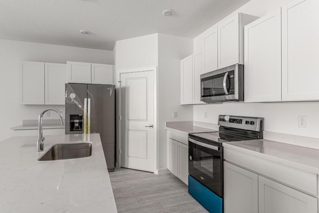 Photo of 1569 NE Skyhigh Terrace, Jensen Beach, FL 34957 (MLS # R10969038)