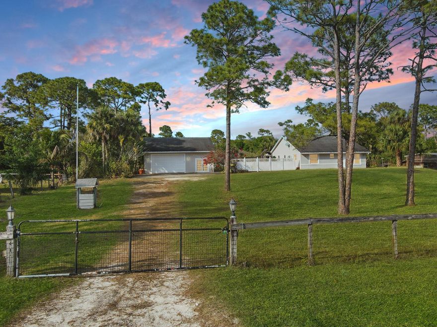 DETACHED GARAGE/WORKSHOP. Presenting 17851 68th St N, a great 3-bedroom, 2-bathroom home offering 2,142 Sq Ft of living space sitting on a spacious 1.14-ACRE fenced lot. Located in the peaceful community of Loxahatchee, this property is just down the street from local schools and conveniently close to shopping, dining, and other amenities. Inside, you'll find a partially remodeled home with modern features and finishes throughout. The kitchen has newer cabinets, sleek countertops, and a farm sink. Both bathrooms have been fully updated with beautiful tile and modern finishes. Additionally, the home features a versatile bedroom, which can easily serve as a guest room, office, or hobby space. The property also includes a LARGE DETACHED GARAGE that can be used as a WORKSHOP
