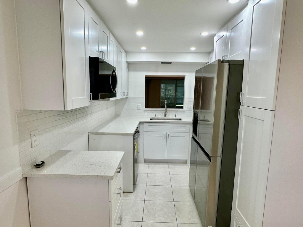 Photo of 23099 BARWOOD Lane N #109, Boca Raton, FL 33428 (MLS # B26063608)