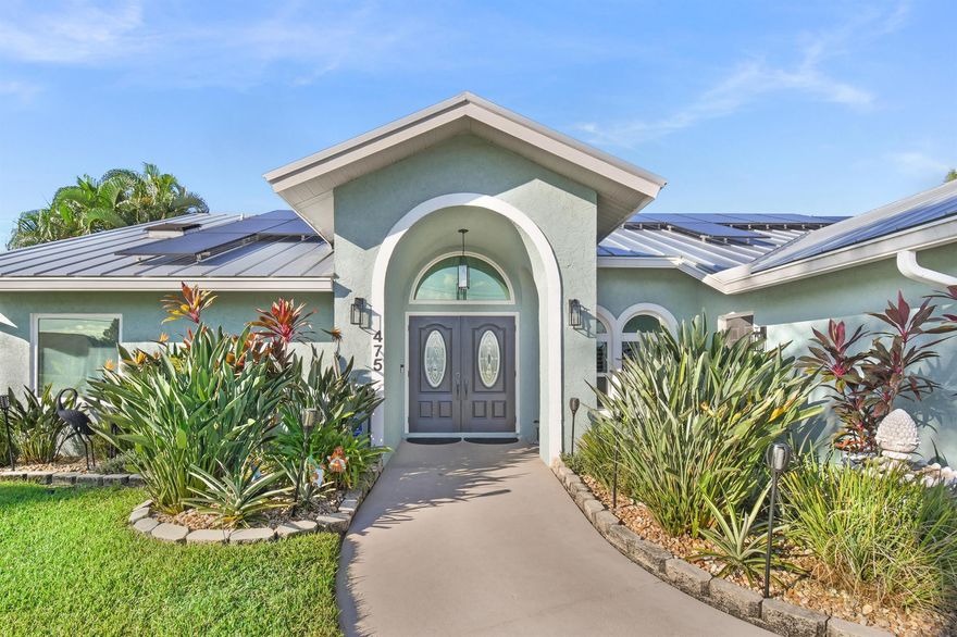 Meticulously renovated and lovingly maintained, this pool home in the heart of Port St. Lucie sparkles inside and out! Major upgrades include a new metal roof (2022), 40-panel solar system (2022), impact windows/doors, new A/C (2019) plus mini-split, updated kitchen and baths with quartz counters (2025), new ceramic tile flooring throughout (2025), new appliances, and freshly painted inside and out. Enjoy your private tropical oasis with a heated saltwater pool/spa, lush landscaping, and screened patio. Whole-house water filtration, ADT security, plantation shutters, and more! Conveniently located near boat ramps, parks, shopping, dining, Turnpike, and I-95. Move-in ready perfection!