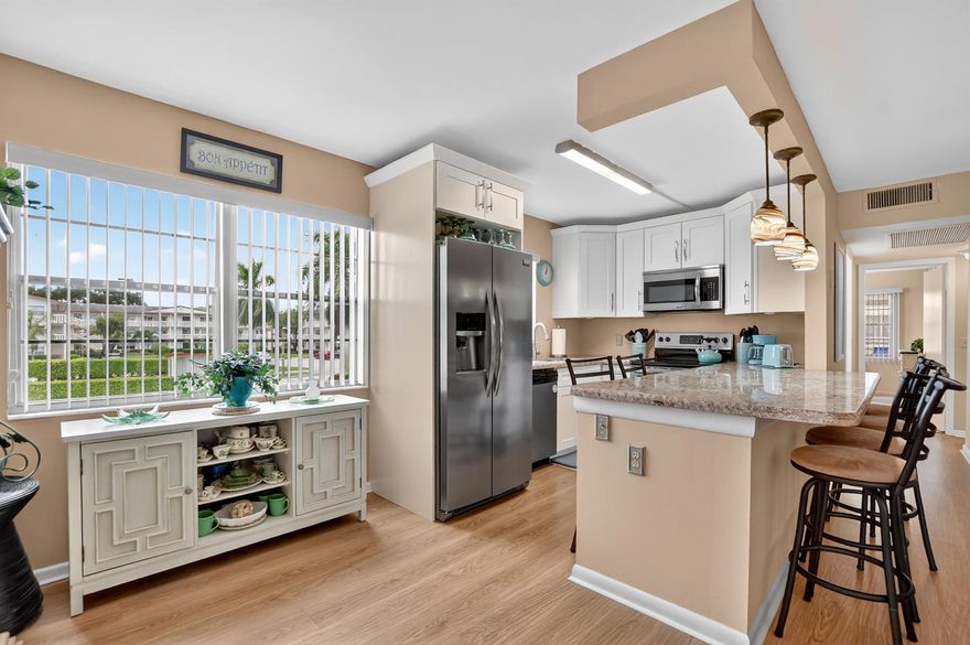 Beautifully updated 2BR/1.5BA corner condo in the sought-after 55+ community of Fanshaw at Century Village! This bright 2nd-floor residence offers an open kitchen with granite counters, white shaker cabinets, stainless-steel appliances, and laminate flooring throughout. Bathrooms feature modern finishes and a walk-in shower. Enjoy morning coffee on the enclosed patio with tranquil green views. A/C 2023. FULLY FURNISHED & EQUIPPED, move right in! Resort-style amenities include pools, clubhouse, fitness center, tennis, pickleball, theater & shuttle. Rent Immediately!