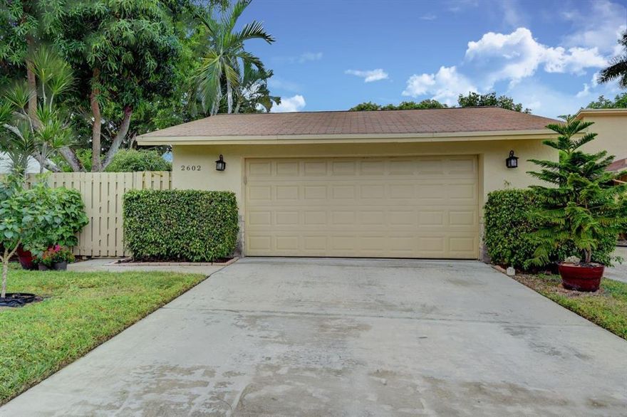 Beautifully update, private corner lot, with serene lake view, and only steps away from the pool and clubhouse.  This single family home is located in the PET FRIENDLY and desirable, gated, 55+ community of Rainberry Bay, located in the heart of Delray Beach.  This homes features a breathtaking kitchen, with newer stainless steal appliances as well as granite countertops and plenty of counter space. Updated bathrooms detailed with chair railing molding.  A/c unit and water heater only a few years old.  HOA includes roof maintenance, lawn care, painting of home, and much more. Two Florida rooms which wrap around the property as well as fenced in court yard with beautiful Mango tree. Oversized two car garage, with plenty of storage.  This home will not last, bring your best offer!
