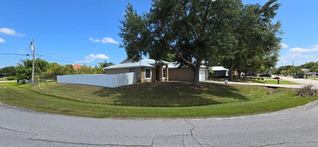 Photo of 2201 SW Plymouth Street, Port Saint Lucie, FL 34953 (MLS # F10520057)