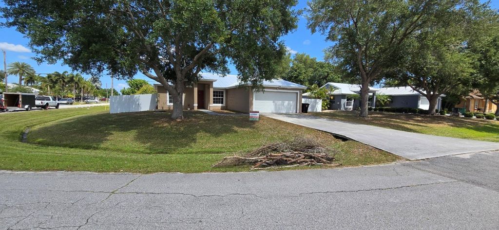 Photo of 2201 SW Plymouth Street, Port Saint Lucie, FL 34953 (MLS # F10520057)