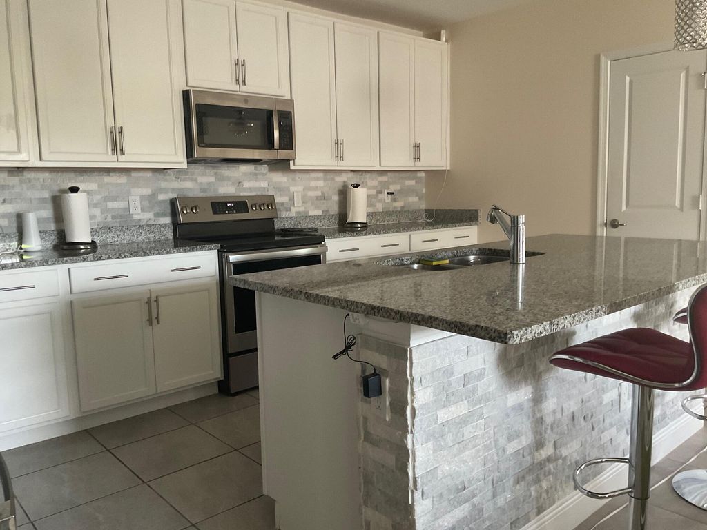Photo of 729 SW Haas Avenue, Port Saint Lucie, FL 34953 (MLS # R11139769)