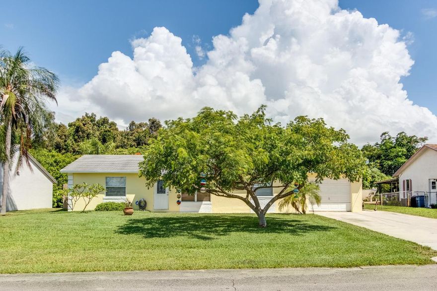 Surrounded by gorgeous landscape this serene paradise is located on a quiet street in a community with no homeowners association. This 3 bedroom, 2 full bath home has been freshly painted inside and out. It boasts a large fully fenced in yard with lush landscape and privacy all around. Property has beautiful screened in patio, owned security system, new stainless kitchen appliances and a new hot water heater. This property is clean as a whistle!