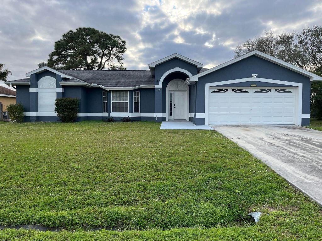 Photo of 1122 SE Puritan Lane, Port Saint Lucie, FL 34983 (MLS # R10963284)
