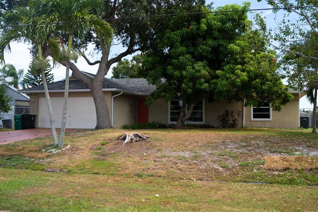 Photo of 2149 SE Aneci Street St, Port St Lucie, FL 34983 (MLS # R10827304)