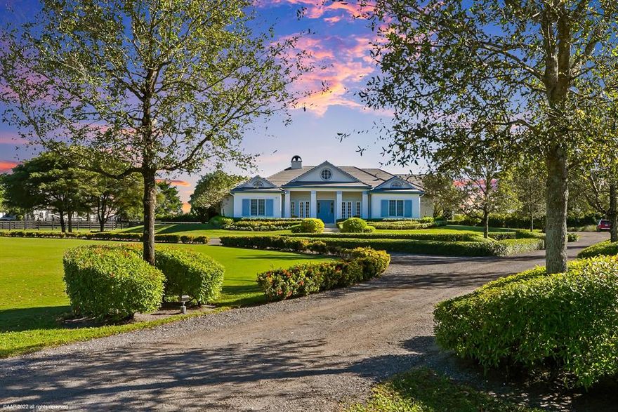 Income producing & for all disciplines! Beautifully appointed home, private 28 stall barn, grass Grand Prix field, covered arena, outdoor ring, euro-walker & round pen on 8.85 acres. All perfectly situated on a beautifully manicured 8.85 acres & just minutes to the WEF, Global & IPC competition venues. The stable boasts 2 mirror image wings: 8 wash stalls, 2 tack rooms, 2 feed rooms, 2 laundry rooms, 2 kitchens, 2 bathrooms, & 2 storage rooms. The 4 bedroom residence with office has an open concept great-room with center-island kitchen, professional gas range,  quartz counters, stunning glass enclosed wine cellar & beautiful wood floors throughout. The primary bedroom suite has a spa-like bath which opens out to a romantic outdoor garden shower.  See ''Supplement'' for additional features.