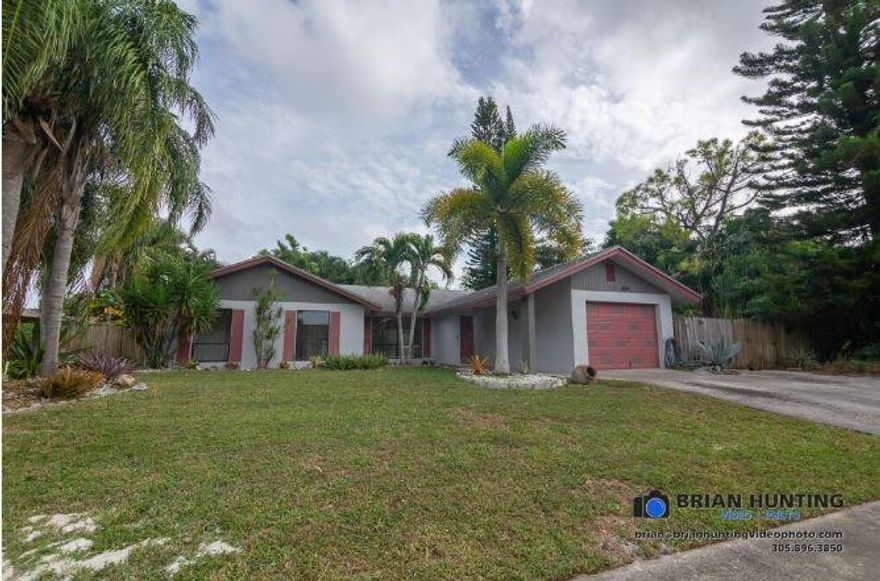 Back on the market!!!  Make this 4 Bedroom, 2 Bath waterfront pool home your new residence!  One of the only properties in the neighborhood with concrete block construction, this home also has a heated pool with a lift, a large 6 person jacuzzi under a large tiki cabana.  Tile throughout the main living areas and wood flooring in the bedrooms.  Part of the garage has been converted to a large office with a laundry closet.  The remaining area of the garage has lots of shelving and ample storage space.  No FHA! Buyer must close with Omega Title.