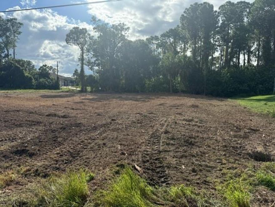 a prime, fully cleared corner lot in the desirable Twin Lake Estates community of Lehigh Acres. This spacious 0.31-acre homesite is ready for permitting and the perfect canvas to build your dream home. Enjoy easy access to major roads, shopping, schools, and local amenities, while still being nestled in a quiet residential area. With public road access and a well-maintained neighborhood setting, this lot offers excellent value for both homeowners and investors. Survey and soil ready – just submit your plans and start building!