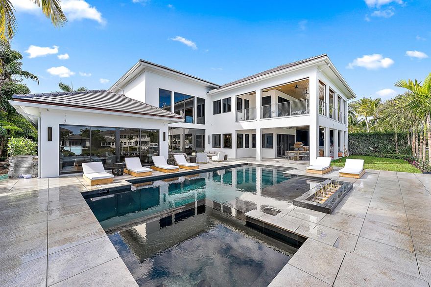 Fresh from a spectacular 2025 transformation, this ultra-high-end contemporary residence in Admirals Cove is a masterpiece of modern luxury. Every detail has been meticulously curated, featuring exquisite finishes throughout. The stunning Downsview kitchen is a showstopper, boasting an illuminated Onyx island, top-tier Wolf, Miele, and Sub-Zero appliances, and custom cabinetry.The lavish primary suite is a private retreat, complete with dual spa-like bathrooms and expansive boutique-style closets. Two additional en-suite bedrooms/flex spaces offer versatility and sophistication, each with walk-in closets. Step outside to an entertainer's dream--an expansive lanai with a full summer kitchen, seamlessly blending indoor and outdoor living.