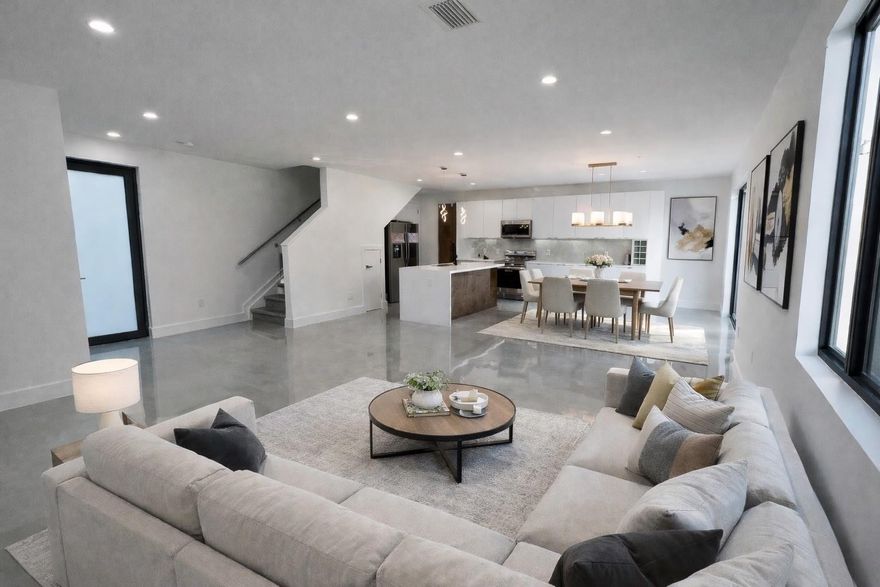 SOPHISTICATED & MODERN living offering walkability & centrally located. This luxury townhome comprised of 3 bedrooms, 2.5 baths, a 2-car garage & Master bedroom w/ balcony, located in synergetic downtown Oakland Park. Offering walkability to great restaurants, shopping & breweries. Only 2 miles from beach & a mile from famous Wilton Drive. Featuring gorgeous 4x4-foot tile floors, Euro style cabinetry & quartz countertops, a full laundry room including sink plus your own private driveway & NO HOA, w/ a beautiful artificial grass backyard, big windows offering an abundance of natural light, plus a sit-in shower, & tankless hot water heater - extra comforts for this stunning late model townhome in an area of incredible investment  & desirability. Ideal investment property or residential home.