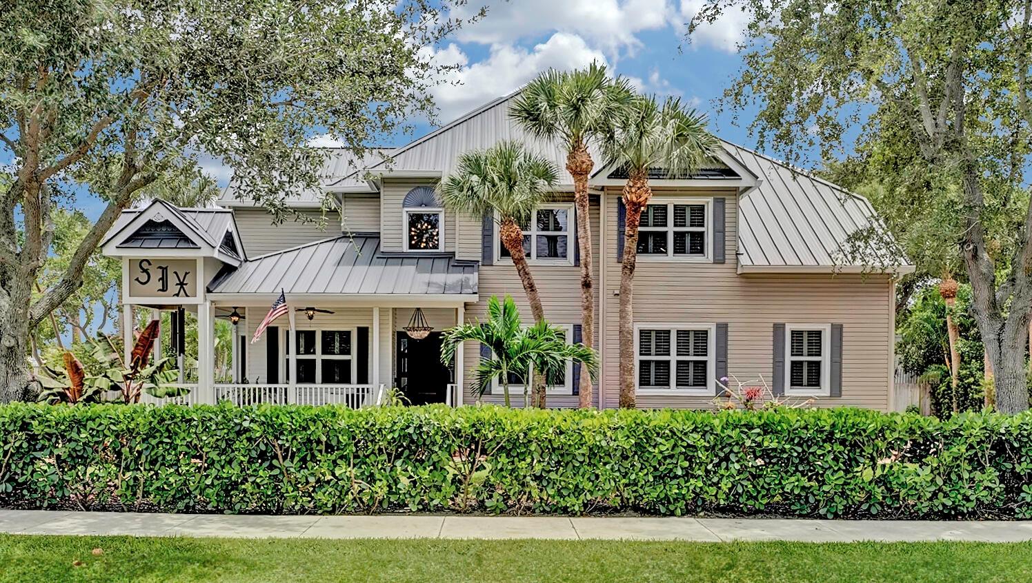 Welcome to an extraordinary residence in the heart of Lake Ida in Delray Beach. Situated just a short stroll from iconic Pineapple Grove and the renowned ''Atlantic Ave,'' this impeccably designed 4-bedroom + Office, 4-bathroom home epitomizes the quintessential Florida lifestyle.Step into timeless elegance and charm as you're welcomed by an enchanting wrap-around porch. Inside, a grand foyer sets the stage for an open living area and formal dining space, featuring soaring ceilings and abundant natural light streaming through expansive windows. Modern coastal touches throughout add a touch of refinement. The primary suite is a retreat, complete with motorized window shades, a cozy sitting area, his and her walk-in custom closets, and a spa-inspired bathroom.