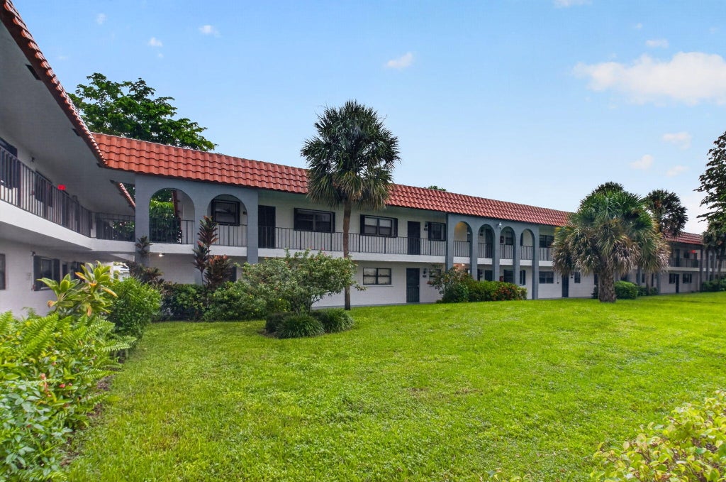 Photo of 2121 W WOOLBRIGHT Road #K202, Boynton Beach, FL 33426 (MLS # B26094191)