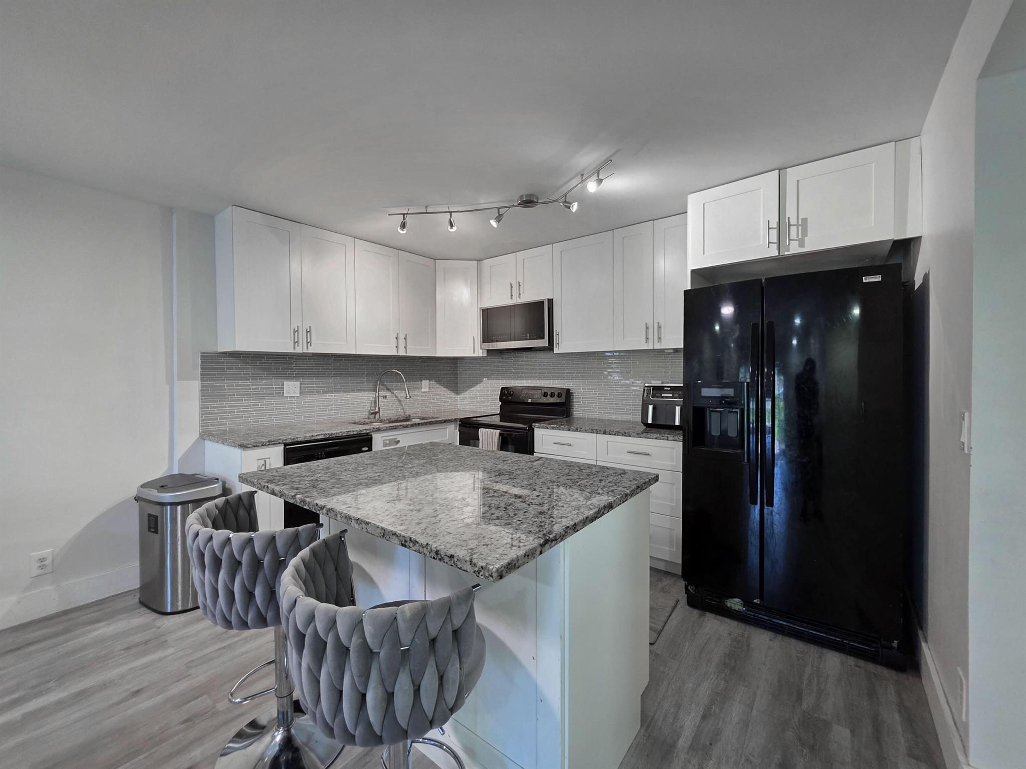 Discover comfort and convenience in this charming ground-floor condo located in desirable Coral Springs! This well-maintained unit offers 'a spacious layout, and a bright and airy atmosphere. Enjoy easy access with no stairs, making everyday living a breeze. Enjoy the open space of living and kitchen area. Don't miss out on this Coral Springs gem!