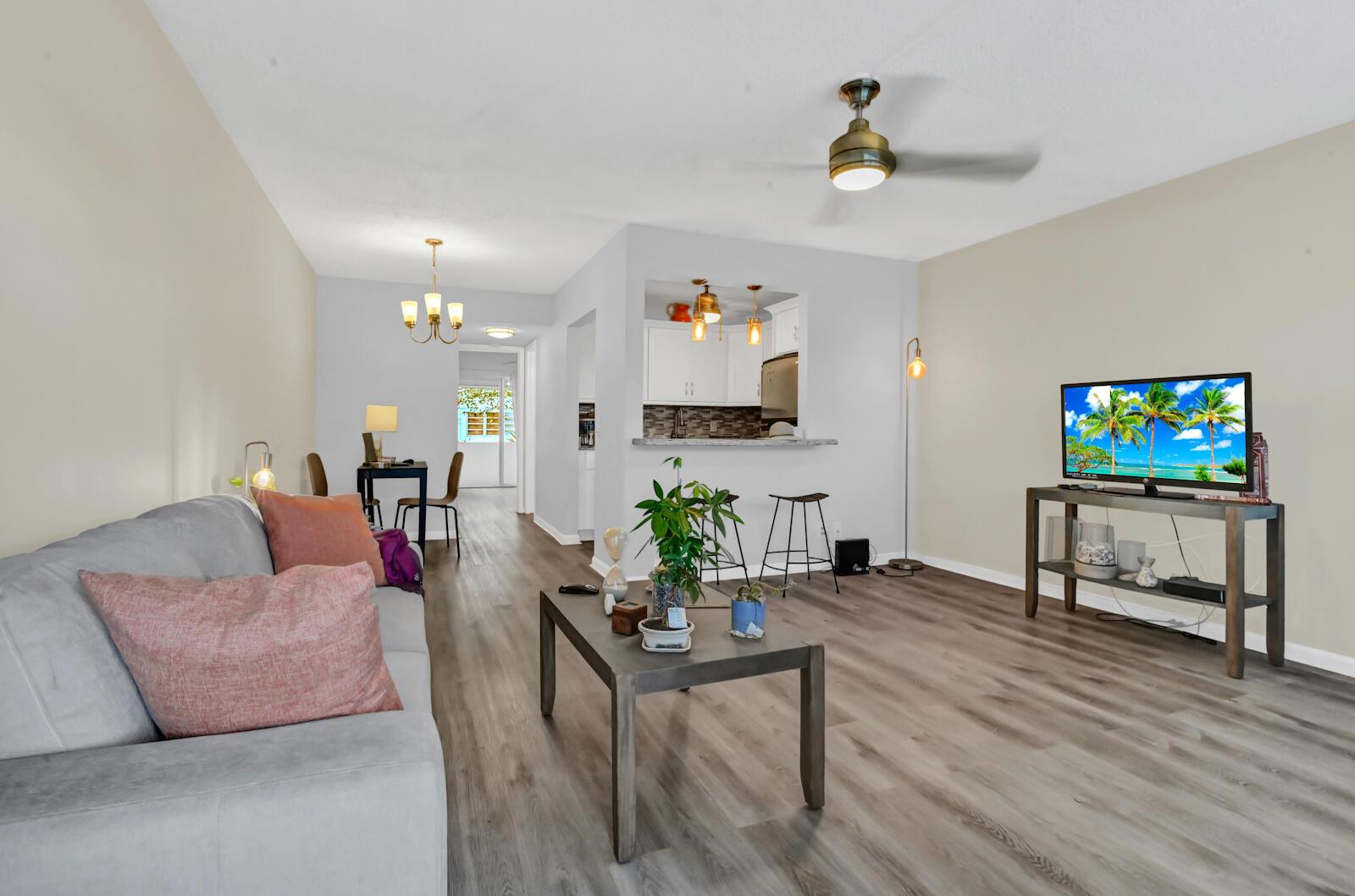 MOVE-IN READY 1st Floor Condo in Vibrant 55+ Community! Experience the perfect blend of comfort and convenience in this immaculate home. Step into a clean and bright living space featuring stunning waterproof laminate flooring and fresh paint throughout. The modern kitchen boasts sleek stainless steel appliances, creating an elegant atmosphere for culinary adventures. With a brand-new roof and newly added parks, this community promises an enhanced lifestyle for active adults. Enjoy a resort-like experience just steps away from the sparkling pools, making relaxation a breeze. Seller is highly motivated!