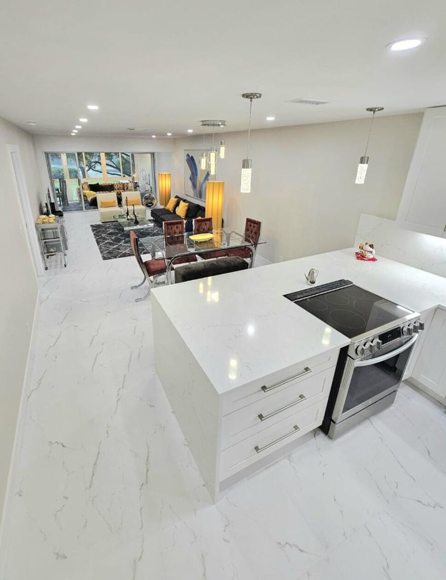 Luxury Delray Condo! 5 minutes to Downtown Delray (Altantic Ave). 10 minutes from world-renowned Blue Flag awarded beach. Open concept Gourmet Kitchen - Misterio Quartz Waterfall with an oversized island (backsplash is quartz too). Slow closing 42" solid wood shaker style cabinets and drawers. Accent under cabinet lighting, coffee/tea area, wine cooler, newer 24 x 24 porcelain tile flooring, Spa like master bathroom w/ double Kohler sinks and quartz vanity countertop. Solid wood vanity features slow closing doors/drawers. Custom glass doors and accent 3D wall in shower area with build-in niches. Newer window treatments, Surround sound system, newer AC. All appliances are SS and newer. Turnkey and Furnished, available for annual rental. Large enclosed Terrace overlooking the tennis courts  The north clubhouse is currently being renovated (under construction). Amenities include: SPA, Pickleball, tennis, fitness room (once construction is completed), 2 heated pools, 24/7 Guarded Gate. All interior doors and the front entrance door have been changed/upgraded. Will consider seasonal rental.