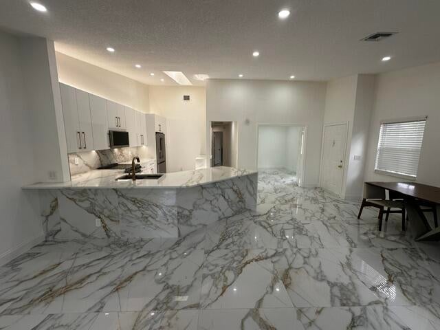 Photo of 2173 Discovery Circle W, Deerfield Beach, FL 33442 (MLS # B26038853)