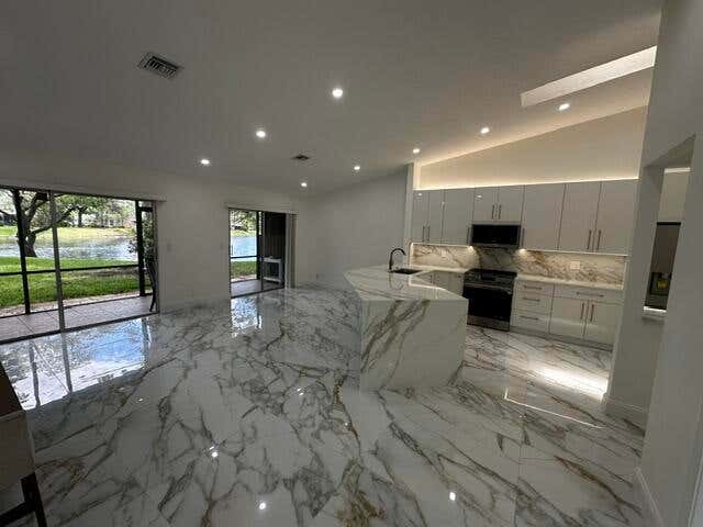 Photo of 2173 Discovery Circle W, Deerfield Beach, FL 33442 (MLS # B26038853)