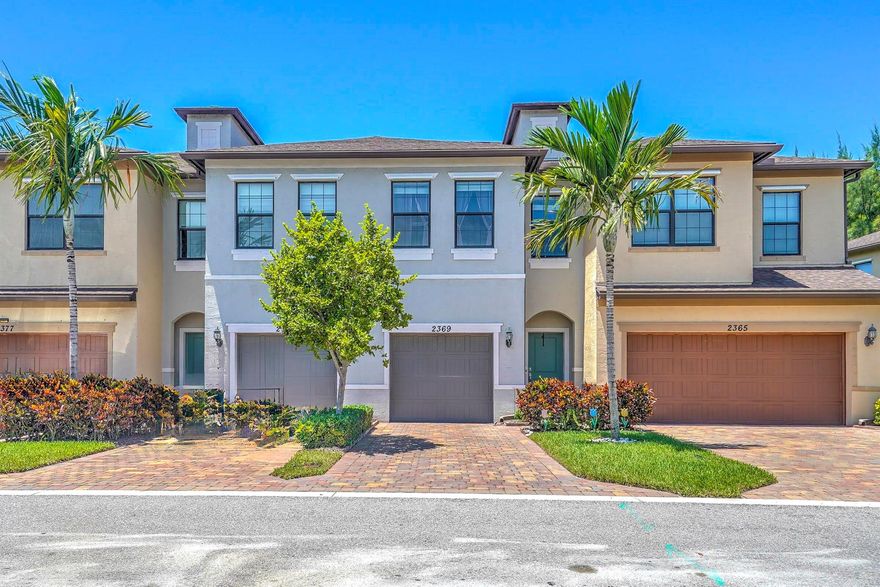 Lakefront 2019 build in Palm Springs! Features 3BR/2.5BA with garage, open plan, big kitchen island, patio on the water, and community pool/gym/trails!Enjoy the morning coffee, lakefront, in this modern townhome featuring light and bright rooms. On the ground floor, find a convenient half bath and your dream kitchen, featuring a large island comfortably seating 4. Ample storage with a full pantry, and 36 inch upper wall cabinets with granite countertops. Upstairs, large bedrooms provide room to spread out, including a primary suite with serene water views. Enjoy the perfect community perks like the swimming pool, playground, nature trails, or fitness center. Walking distance to restaurants, Publix, GNC, Gamestop, banks, and shopping. Just 15 minutes to the beach! Welcome home!