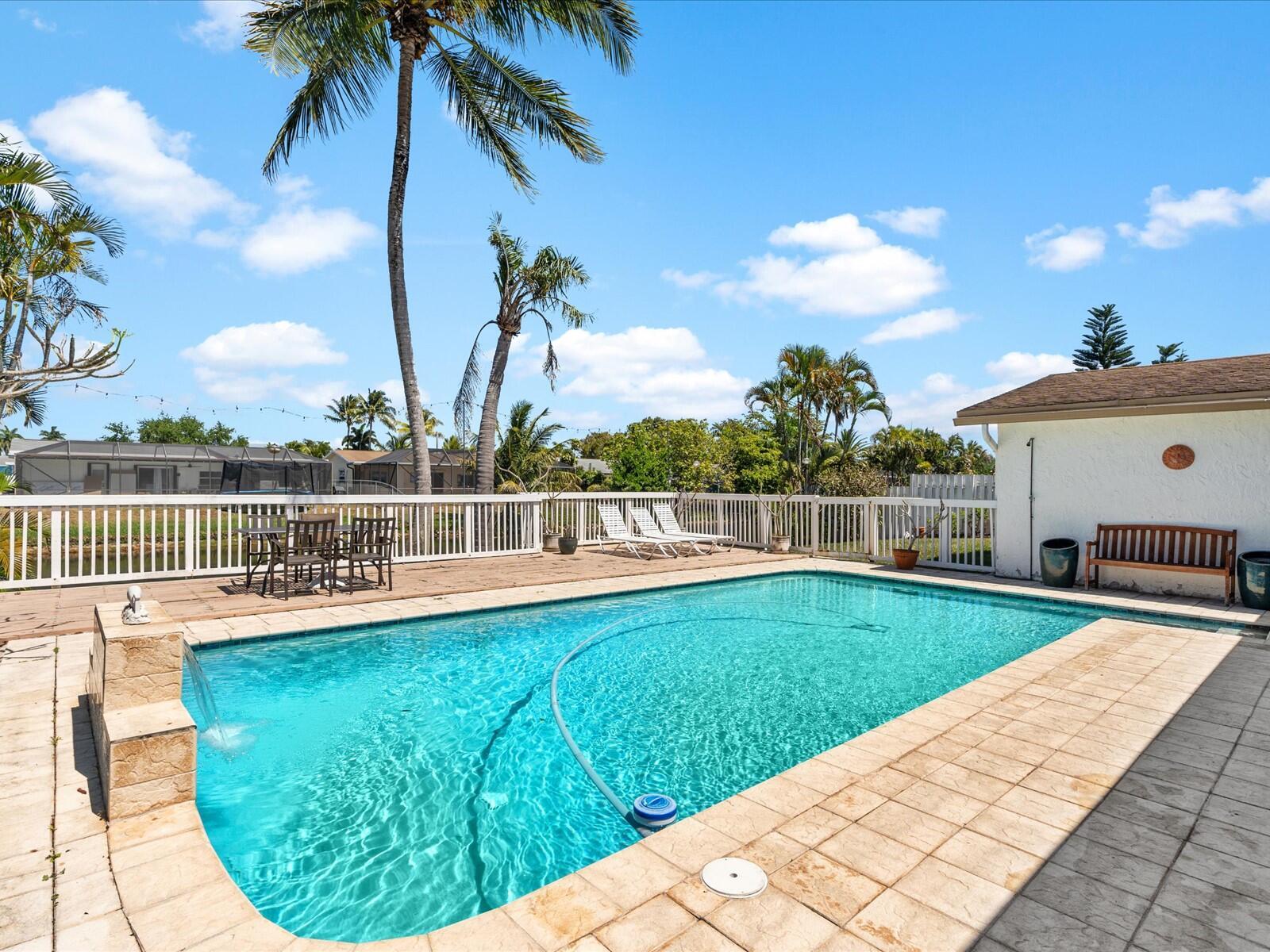 For the first time on the market! This one-owner, 4-bedroom, 2-bathroom pool home is situated on an oversized lot with spectacular canal views! This well-maintained property features a spacious layout, an oversized 15'x30' pool with a deck, and a wide-covered patioa"perfect for outdoor entertaininga"all overlooking a serene canal. Additional highlights include a circular driveway, a 2-car garage, and an irrigation system that draws from the canal for added efficiency. Inside, enjoy a kitchen with granite countertops, wood cabinetry, and tile and wood flooring throughout. The split-bedroom floor plan offers both privacy and functionality. Located just minutes from Sawgrass Mills Mall, I-75, Panthers Arena, shopping, restaurants, and grocery stores. A rare opportunity for space, comfort an