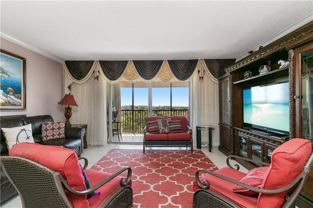 Welcome home to this top floor gorgeous 3 bedroom 2 bath corner unit condo! This unit will come completely furnished! Polished tile flooring throughout, open concept living/dining that opens up to a balcony over looking the golf course. Updated bathrooms, lots of closet space and 3 large bedrooms that complete this home. Schedule your showing today! Maintenance includes water, trash, sewer, security, cable tv, lawn.